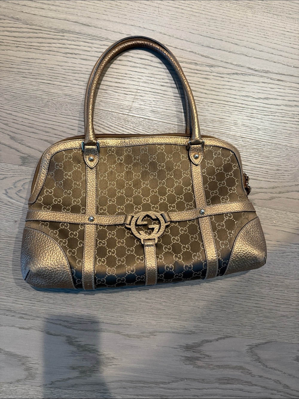 Women’s Gucci gold handbag